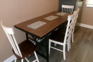 A dining table with four chairs, each with a name card. - 3 bedroom one bathroom in High point N.C. near HPU, (High Point)