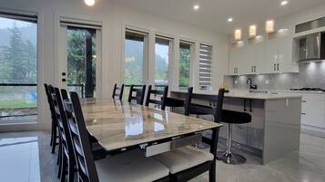 A modern kitchen with a large island, stainless steel appliances, and ample counter space.