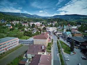 A town with a central road, buildings, and surrounding greenery. - Klarka 4 by Interhome (Rokytnice nad Jizerou)