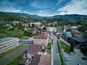 A town with a central road, buildings, and surrounding greenery. - Klarka 1 by Interhome (Rokytnice nad Jizerou)