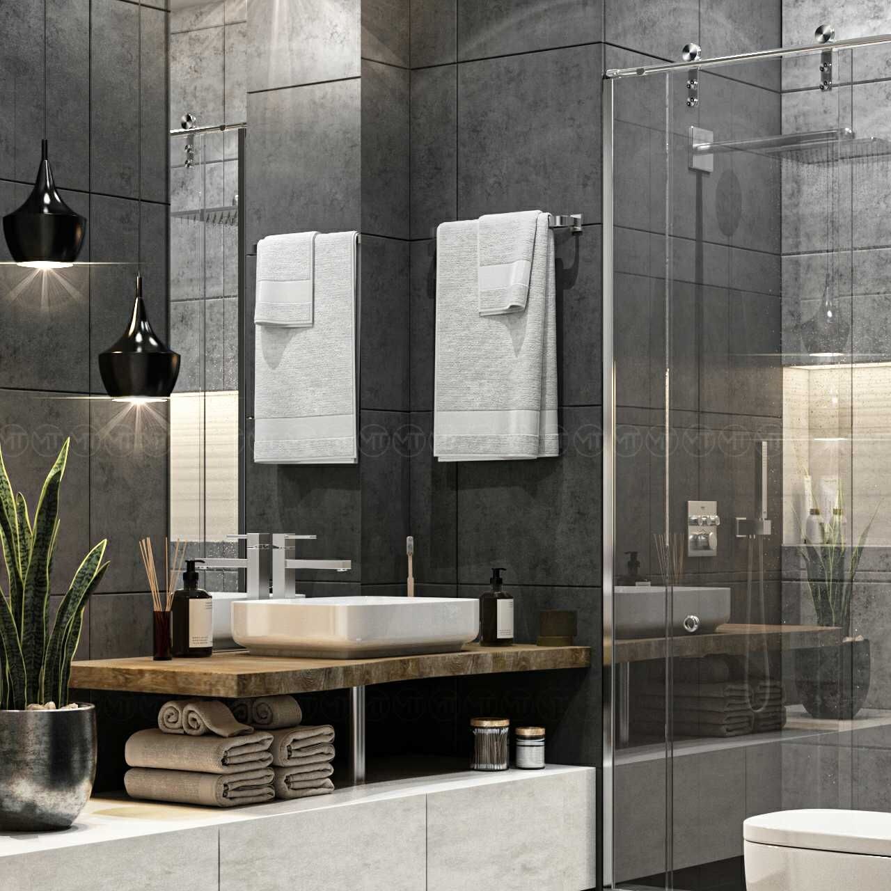 Un baño moderno con un espejo grande, dos toallas blancas, un lavamanos y una cabina de ducha de vidrio.