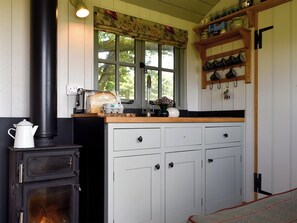 Kitchen and lounge area with wood burner | Romney Hut, Jacob Hut - Tilbury Farm, West Bagborough, near Taunton - Romney Hut - UKC4067 (West Bagborough, near Taunton)