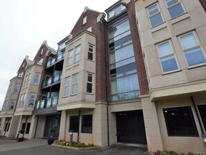 A multi-story building with a prominent entrance labeled 'Caedmon's Prospect.' - 2 bedroom accommodation in Whitby (Whitby)