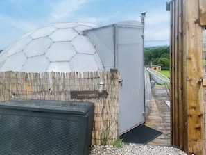 A greenhouse with a hexagonal dome structure, a wooden fence, and a sign that reads 'WEETS HILL'. - Weets Hill Dome - UKC9598 (Earby)