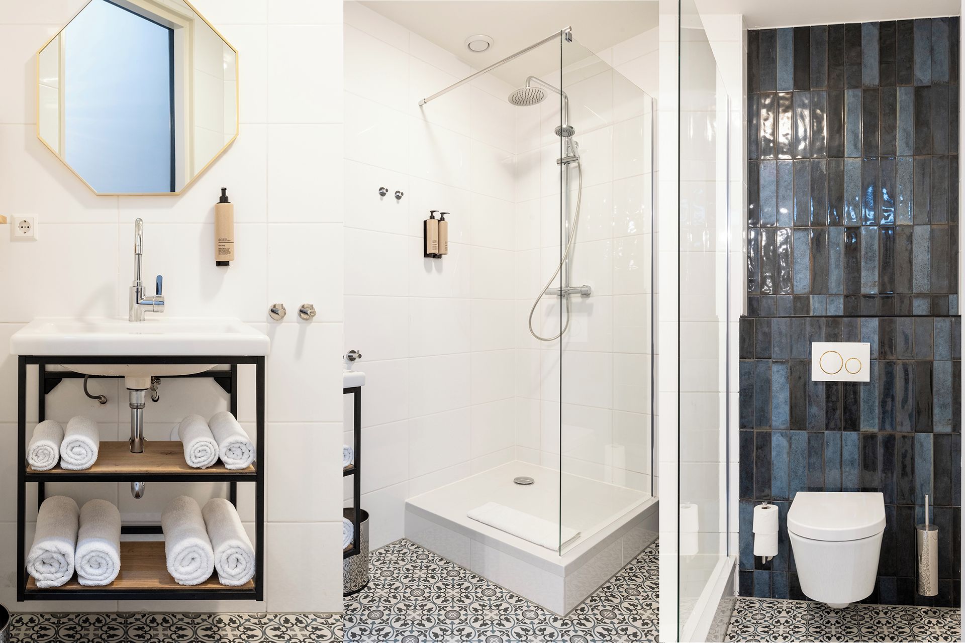 A bathroom with a white sink, a glass-enclosed shower, and a toilet.