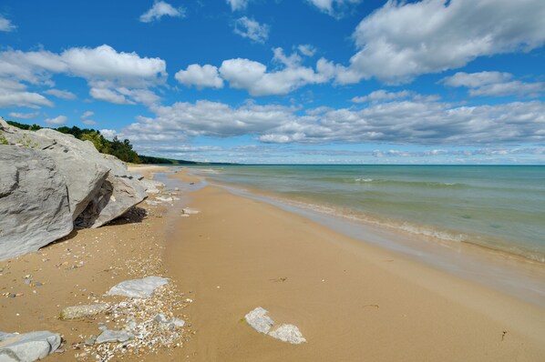 A beach with clear skies and calm waters.