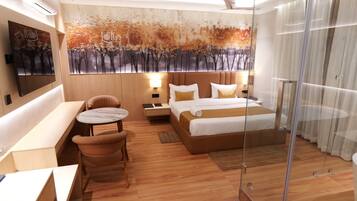 A modern hotel room with a bed, a desk, a chair, and a large artwork on the wall.