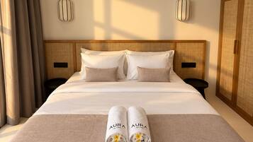 A hotel room with a large bed, two bedside tables, a wardrobe, and a window with curtains.