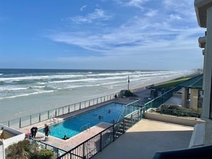 A swimming pool with a view of the beach and ocean. - 3202 Towers in Ponce Inlet, FL (Ponce Inlet)