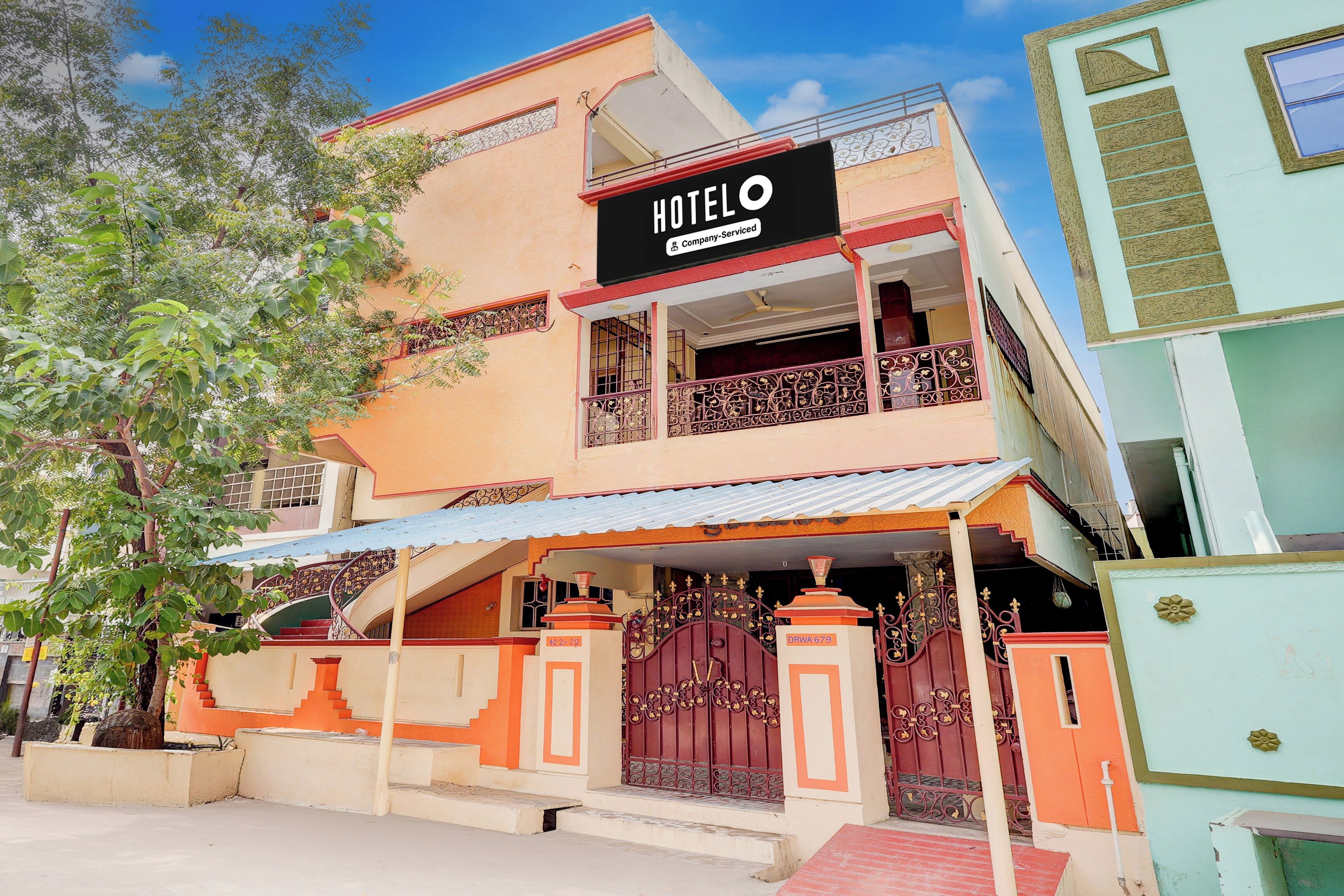 A two-story building with a sign indicating it's a hotel.