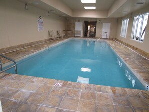 An indoor swimming pool with a no diving sign, tiled walls, and a clear view of the pool area. - #206 St. Maarten 3/3 Luxury Oceanfront Condo Daytona Beach Shores (Daytona Beach Shores)