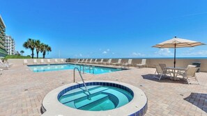 A pool area with lounge chairs and a hot tub. - #7306 Towers 8&9 Oceanfront 2/2 condo (Ponce Inlet)