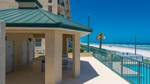 A hotel with a covered outdoor area, a pool, and a view of the beach. - #3502  Ponce Inlet Oceanfront (Ponce Inlet)