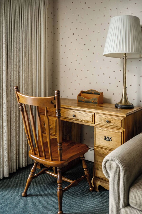 A wooden desk with a lamp, a chair, and a small wooden box. - Beachside Escape: Waterfront view: 1 block to town (Boyne City)