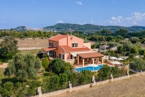 A two-story house with a swimming pool, surrounded by greenery and hills in the background. - Vistabona, 5StarsHome Mallorca Villa (Capdepera)