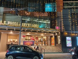 A hotel with a sign for 'The Maitis Hotels & Resorts' and a visible entrance.