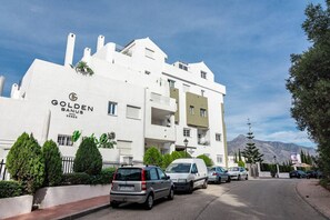 A multi-story building with the signage 'Golden Banus Homes.' - GO- Golden Banus by Roomservices (Marbella)