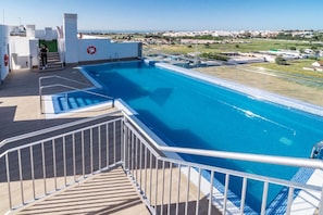 A swimming pool with a clear view of the surrounding landscape, a lifebuoy, and a staircase leading to an upper level. - Apartment with 3BR, garden, pool & gym - JG5. 4A (Marbella)