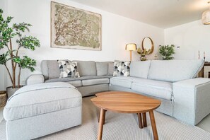 A modern living room with a sectional sofa, a round coffee table, and decorative pillows. - LME101A- Lovley Apartment with stunning views (Estepona)