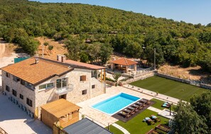 A stone building with a swimming pool and outdoor seating. - Awesome home in Lukar with private swimming pool, can be inside or outside (Lukar)