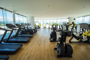 A gym with treadmills, weight machines, and cardio equipment. - Ocean views in luxury complex. (Nuevo Vallarta)