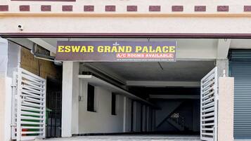 A sign for 'ESWAR GRAND PALACE' indicating A/C rooms are available.