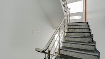 A staircase with metal handrails and granite steps.