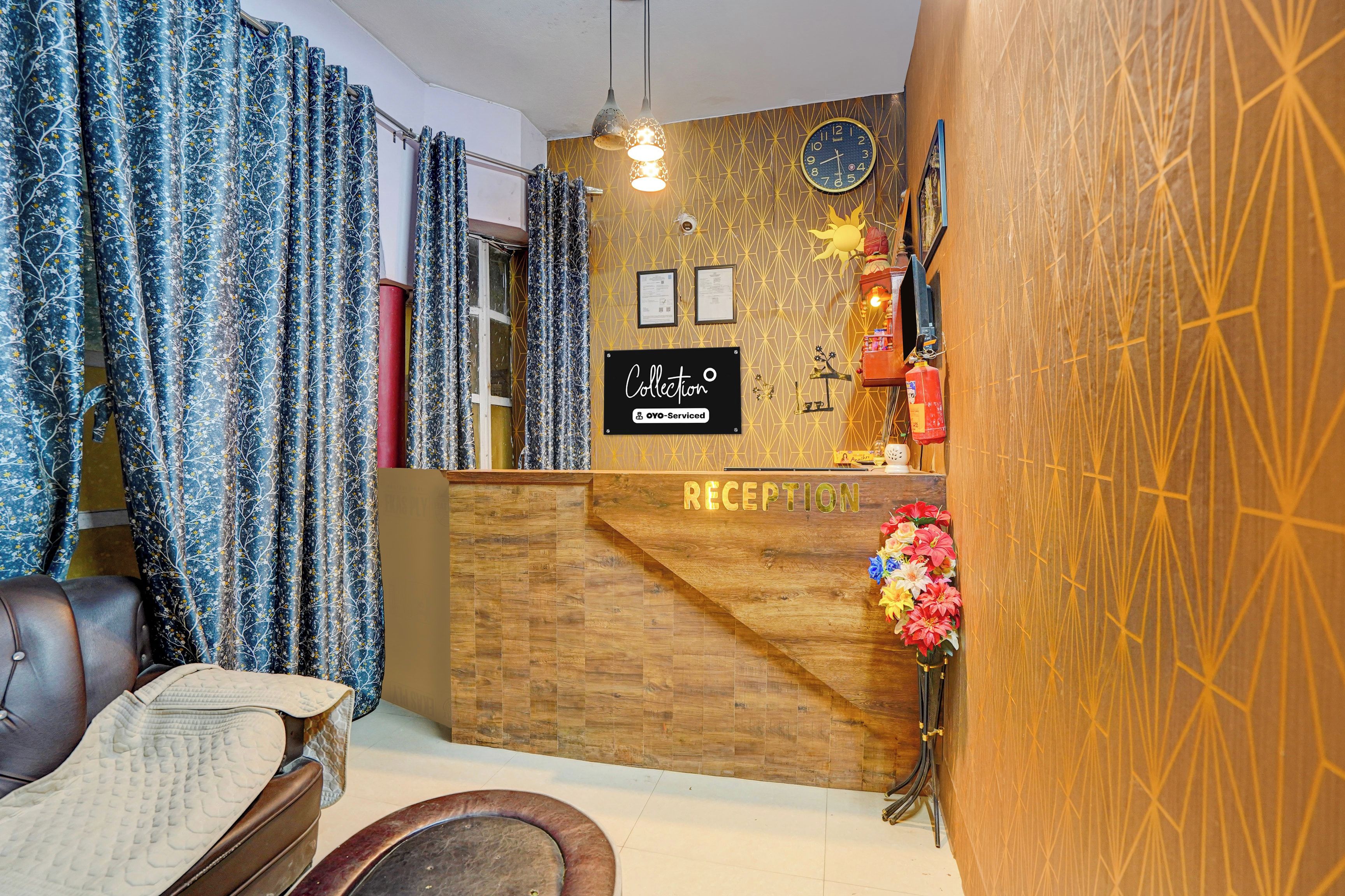 A reception area with a wooden reception desk, a clock, and a fire extinguisher.