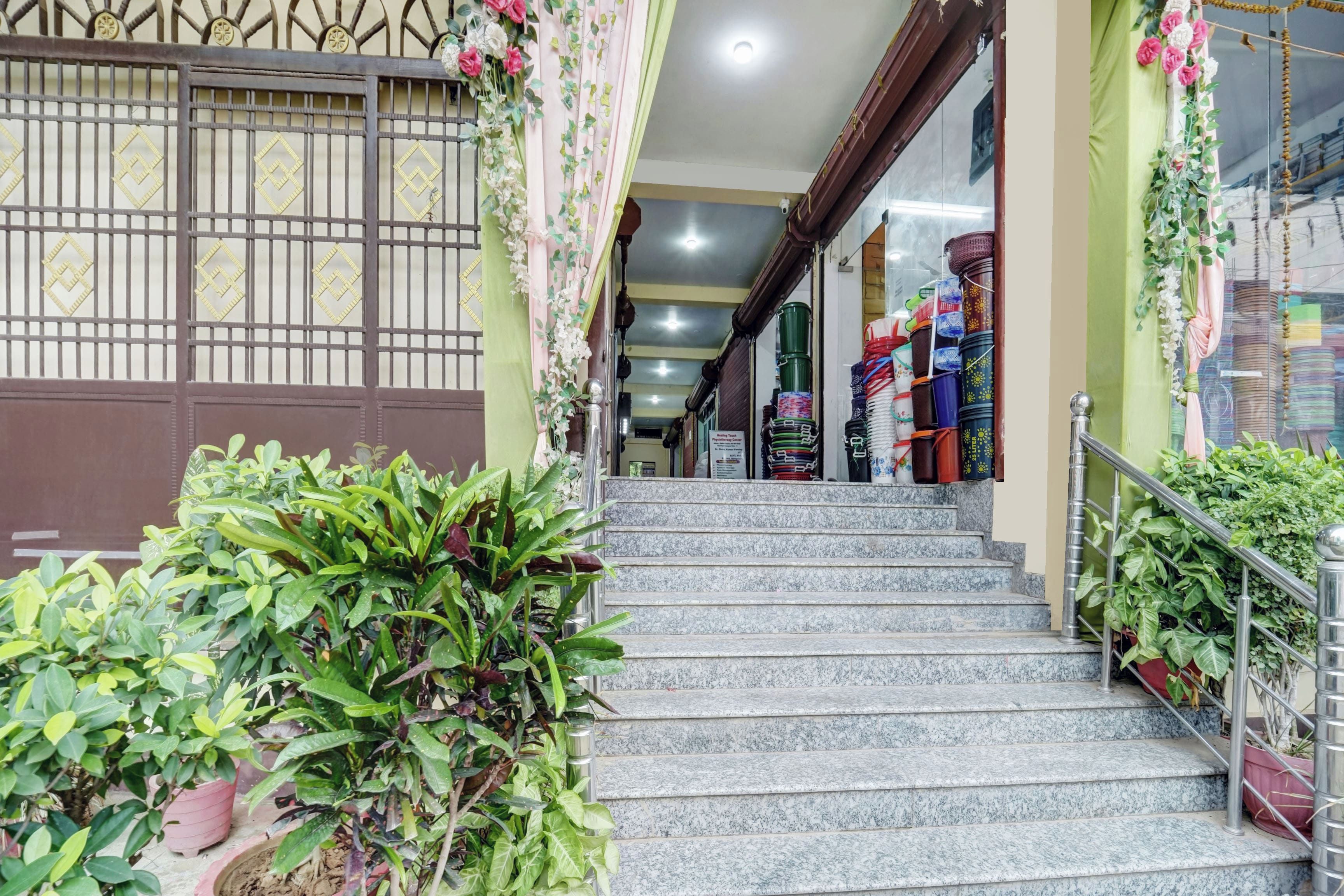 A staircase leading to a shop with colorful items on display.