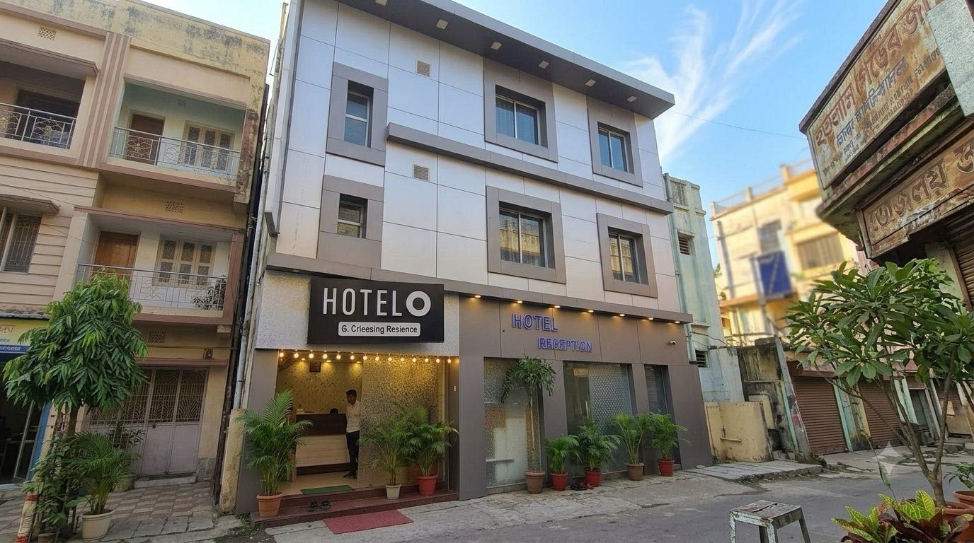 A hotel with a reception area, a signboard, and potted plants.