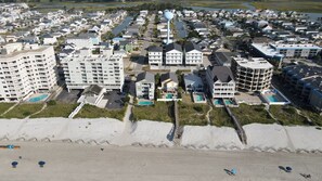 A coastal residential area with multiple apartment buildings, a marina, and a beach. - Ocean Views • Private Pool and Spa • 12 Sleeping Rooms • Sleeps 28 (North Myrtle Beach)