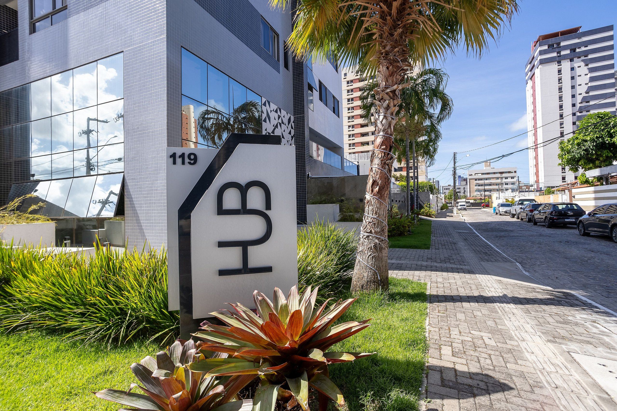 A modern building with a sign indicating '119' and 'HUB' on the facade.