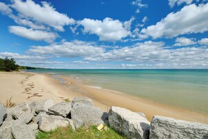 A beach with clear skies and calm waters.