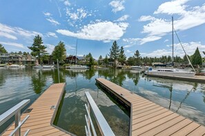 A marina with docked boats, a wooden dock, and a clear sky. - 615 Alpine Drive 3 Bedroom Home (South Lake Tahoe)