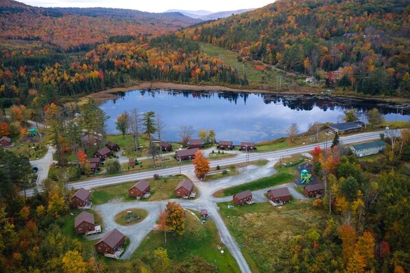 A lakeside community with houses and a road.