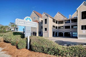 A multi-story building with a sign indicating 'CAPE CODDAGES II' and addresses '1113' and '1115'. - Cape Coddages 205 · Oceanfront 2BR Surfside Beach (Surfside Beach)