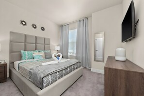 A modern bedroom with a large bed, a flat-screen TV, a bedside table, and a wardrobe. - Casa 3Q c/ Piscina e Game Room Disney (Clermont)