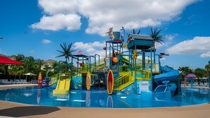 A water park with slides and a pool. - Luxury 6BR Encore Home w/ Pool Near Disney (Kissimmee)