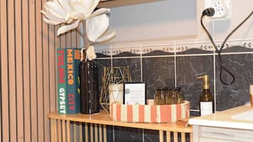 A kitchen counter with a book titled 'Mexico City' and a decorative vase.