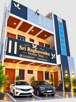 A modern hotel with a prominent sign reading 'Sri Raghavendra Home Stay.' - Sri Raghavendra Homestay (Mantralayam)
