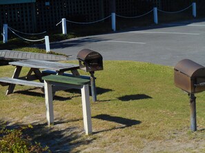 A picnic area with a bench and two mailboxes. - A Place at the Beach (Isle of Palms)