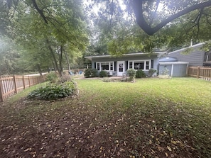 A residential property with a house, a fenced yard, and a garden area. - Portland Mills Ramp Drive (Greencastle)