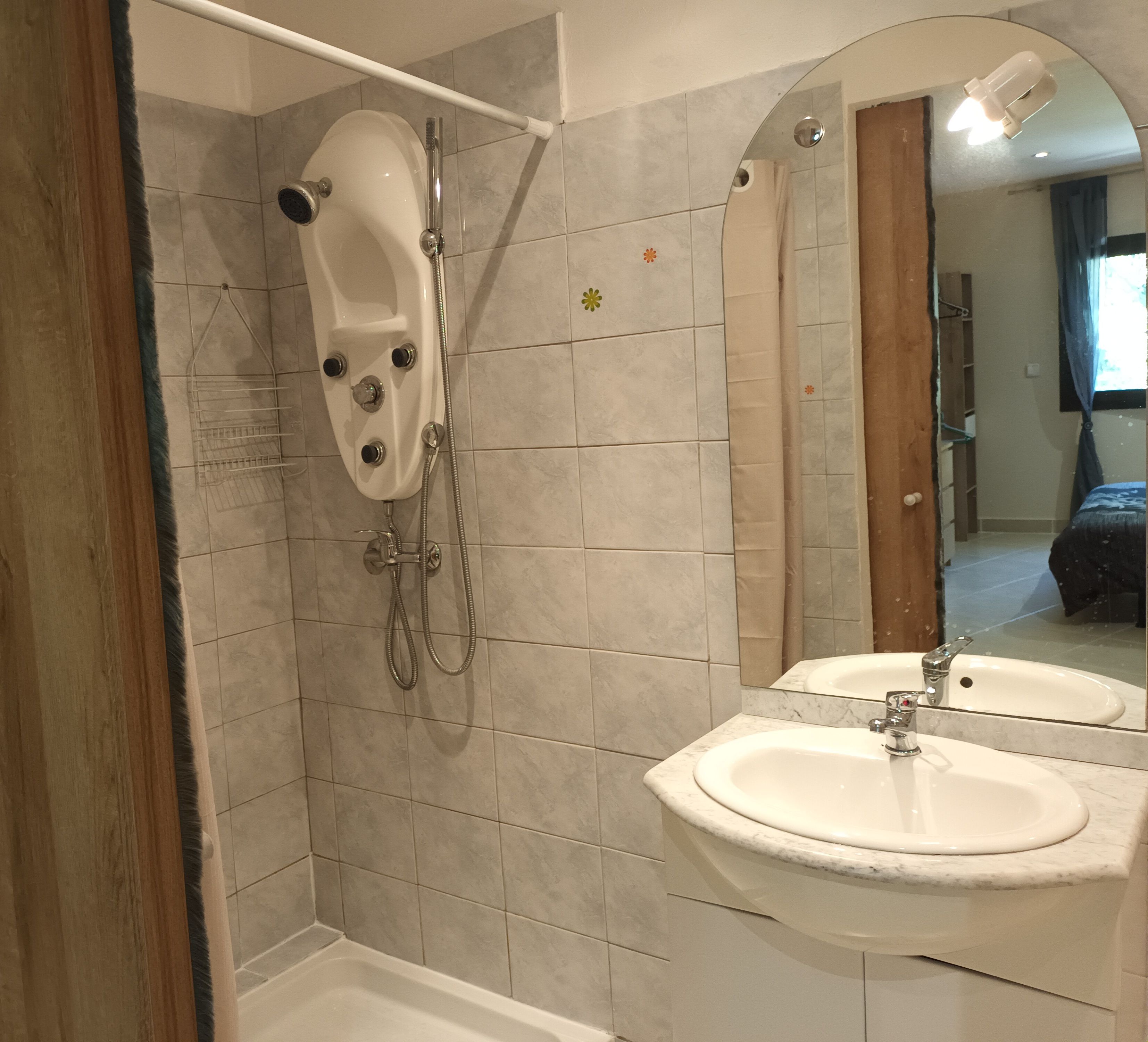 A bathroom with a bathtub, a shower, and two sinks.