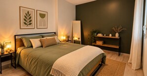 A modern bedroom with a large bed, bedside tables, a mirror, and a shelf with decorative items. - Le Cocon de Saint-Herblain, private parking (Saint-Herblain)