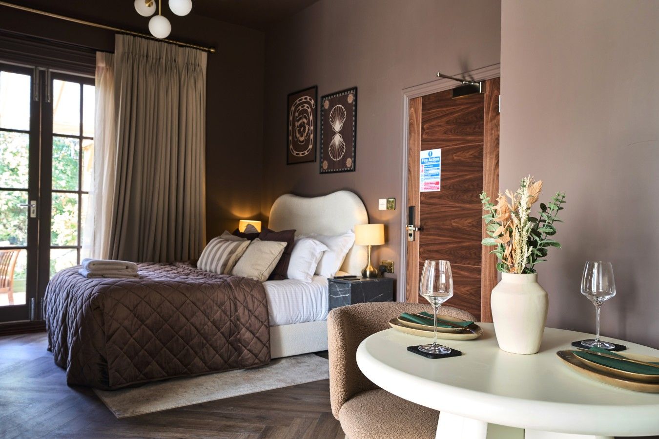 Spacious suite with king size bed, dining space, and doors to your private terrace