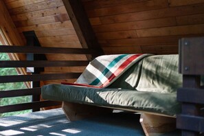 A wooden cabin with a single bed and a window. - The Wildhood Cabin - River Front A-Frame (Rhododendron)