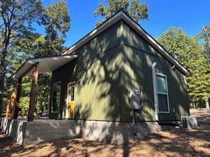 A small, single-story building with a porch, a door, and a window. - Charming, secluded bungalow in the Mountain View area. (Mountain View)