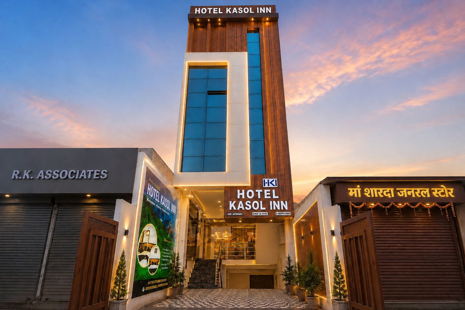 A hotel with a modern facade, a prominent sign for Hotel Kasol Inn, and a visible entrance with a staircase.