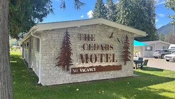 The Cedars Motel sign with a 'No Vacancy' notice.