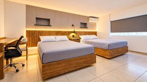 A modern hotel room with two wooden beds, a desk, and a chair. - Bowra Suite Privada 7, Colonia Americana (Guadalajara)